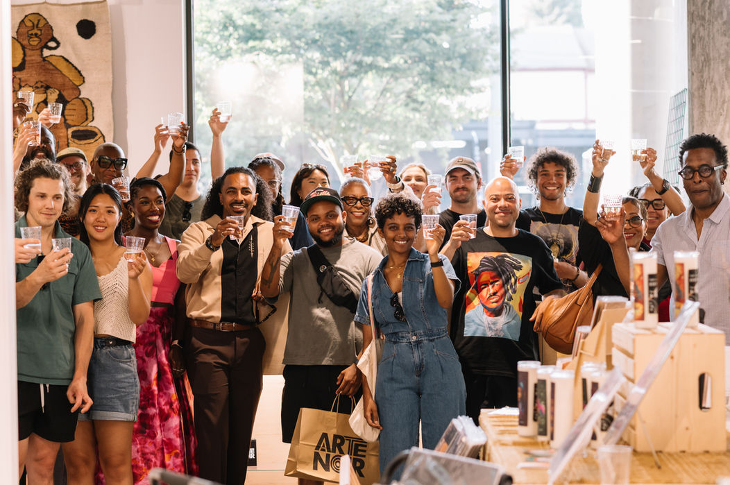 Diverse group celebrating at Arte Noir