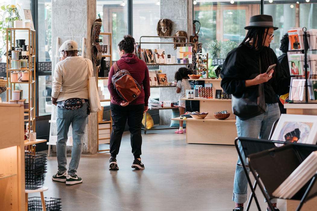 Shoppers browsing artisan goods in a modern store