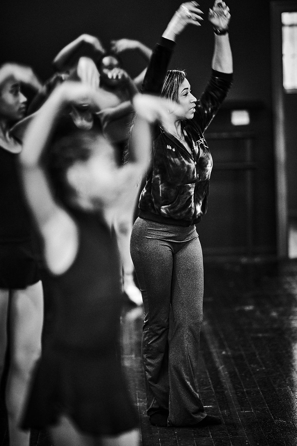 AREA Founder and Executive Artistic Director Jai McClendon Carpenter demonstrates proper technique alongside her students.