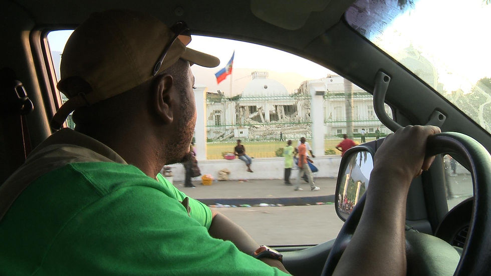 David Pierre-Louis driving through Haiti's capital city.
