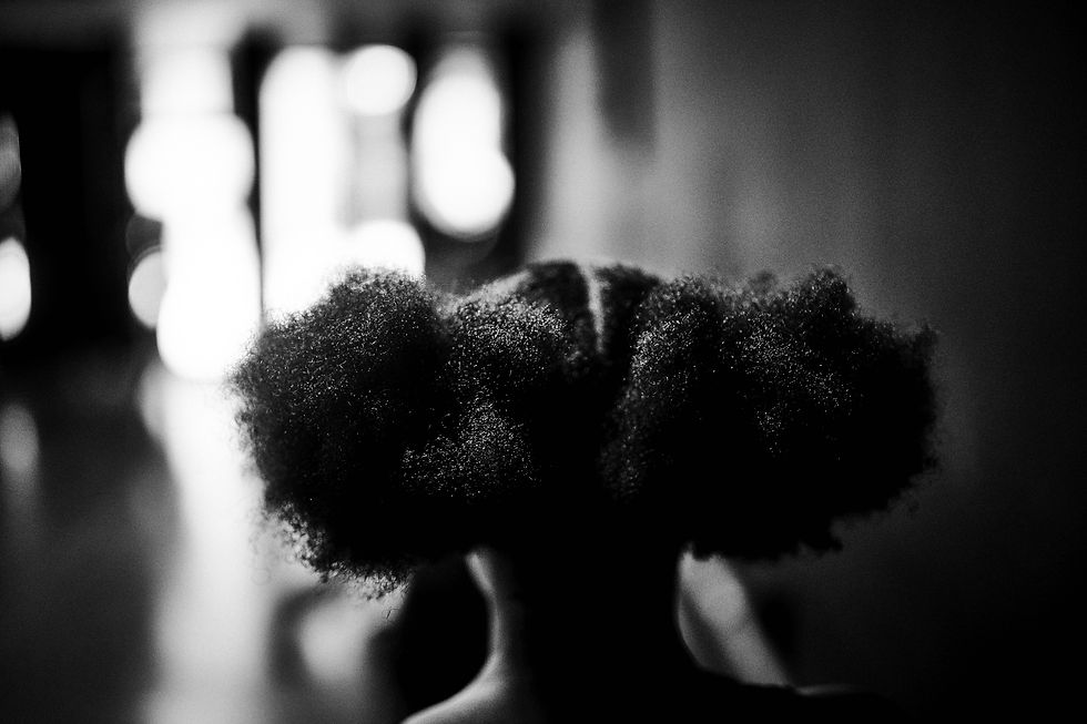 A close view of a dancer’s hair during training at AREA Atlanta.