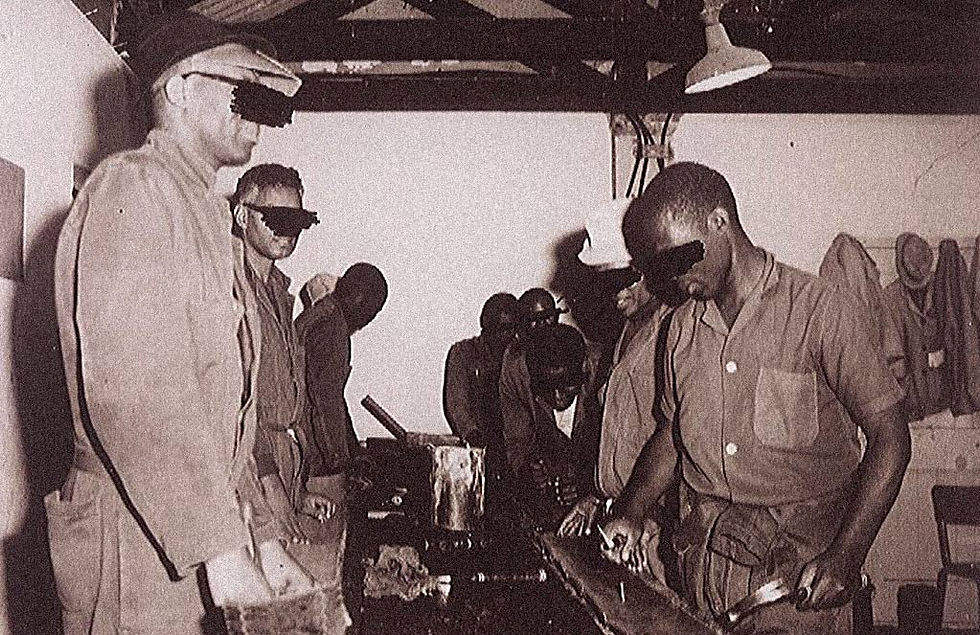 Prisoners in the workshop. This image was staged and taken for the International Red Cross visit. Courtesy of Robben Island Museum.