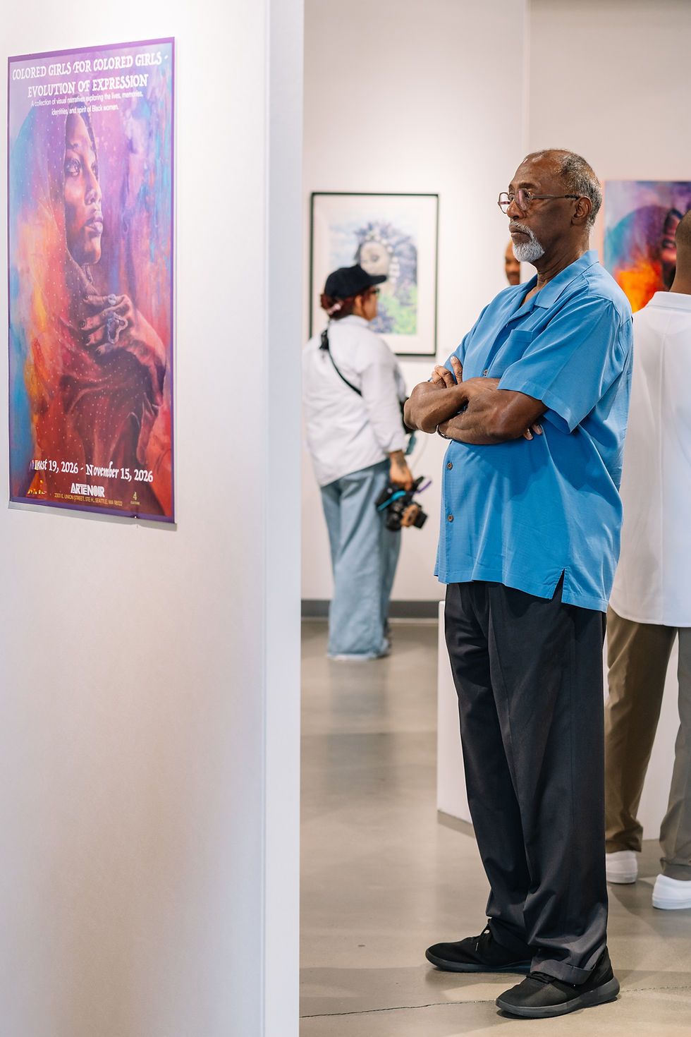 A visitor takes in the art at Colored Girls for Colored Girls in the ARTE NOIR gallery. Credit Hilary Northcraft.