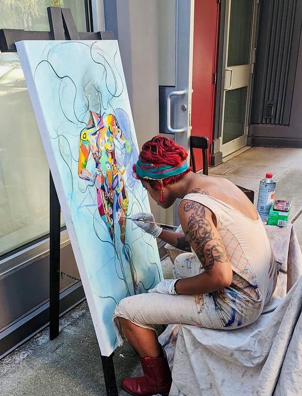 AshaAung Helmstetter at work on In My Pride I Am Goddess, taken at City of Light Gallery. Courtesy of the artist.